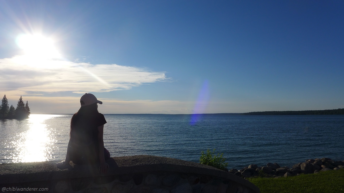 lady in a lake under the sunset
